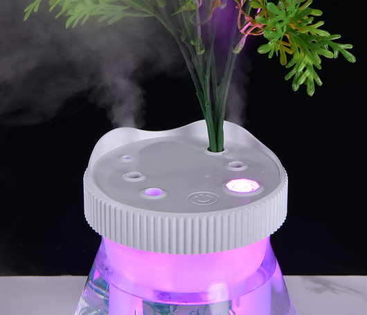 Creative desktop humidifier with artificial red roses, clear base, pink top, and color-changing LED light mist. - Image 16