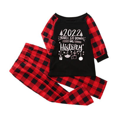 White long-sleeve pajama top with "wild one" graphic and red and black plaid pants. - Image 7