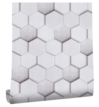 Roll of peel and stick wallpaper with a white and light gray geometric hexagonal pattern, creating a 3D effect.