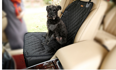 Black quilted waterproof pet car seat for front passenger seat, with a small black dog sitting inside. - Image 2
