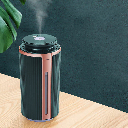 Green and rose gold mini silent humidifier with ribbed texture, USB night light, and water level indicator.