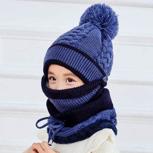 Young child wearing a pink and grey knitted hat with a pom-pom and a matching neck warmer with a drawstring. - Image 9