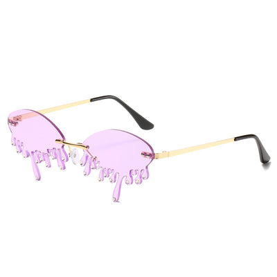Rimless sunglasses with dark gray dripping liquid-shaped lenses, silver studs, and gold metal frames. - Image 20