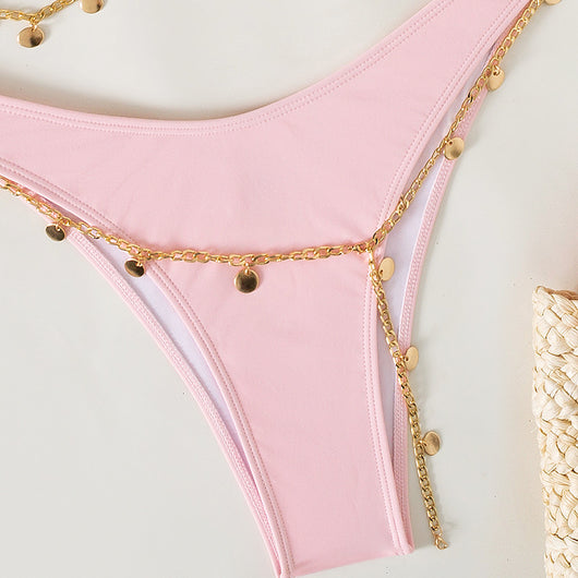 Black two-piece bikini with a bandeau top and high-cut bottoms, adorned with a gold-colored body chain. - Image 7