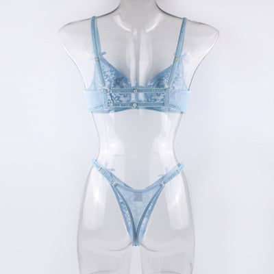 Light blue lace bralette and thong lingerie set with bow details and ruffle trim, displayed on a light surface. - Image 13