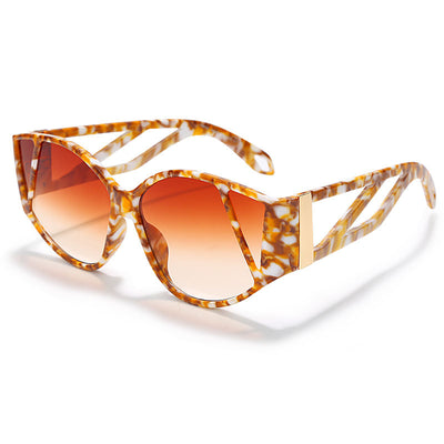 Light peach cat-eye sunglasses with purple gradient lenses and geometric cutouts on the frame. - Image 6