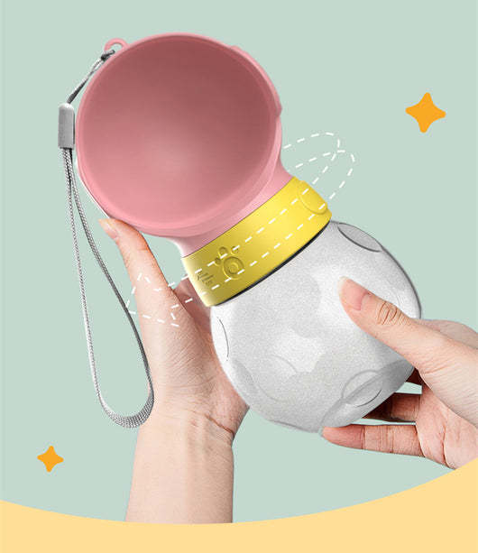 Portable pet water bottle with white drinking bowl, translucent grey reservoir, and yellow paw print band. - Image 11