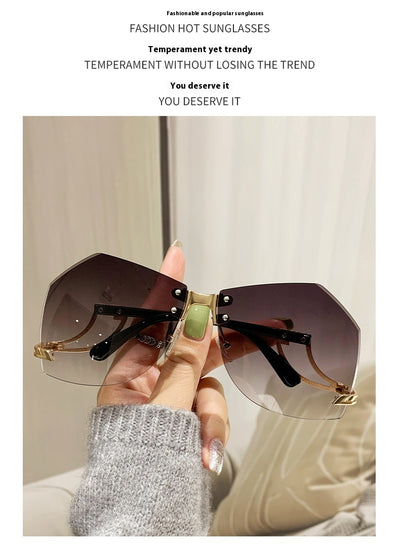 Rimless sunglasses with gradient pink lenses and gold-tone hollow temples, featuring a unique quadrilateral shape. - Image 11