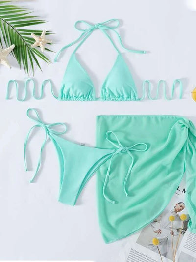 Neon yellow three-piece bikini set with triangle cup lace-up top, tie-side bottom, and matching sarong, displayed with a straw hat and sunglasses. - Image 12