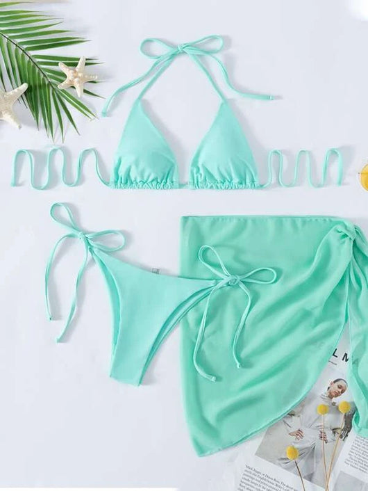 Neon yellow three-piece bikini set with triangle cup lace-up top, tie-side bottom, and matching sarong, displayed with a straw hat and sunglasses. - Image 12