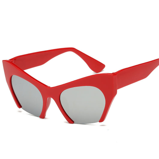 Red cat-eye sunglasses with silver mirrored lenses, featuring a bold retro frame design. - Image 17