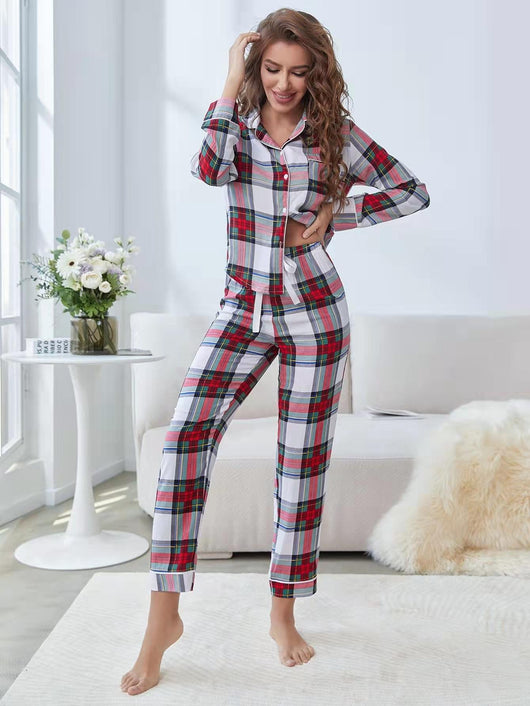 Woman wearing a red, white, and green plaid two-piece pajama set with a button-up top and long pants. - Image 9