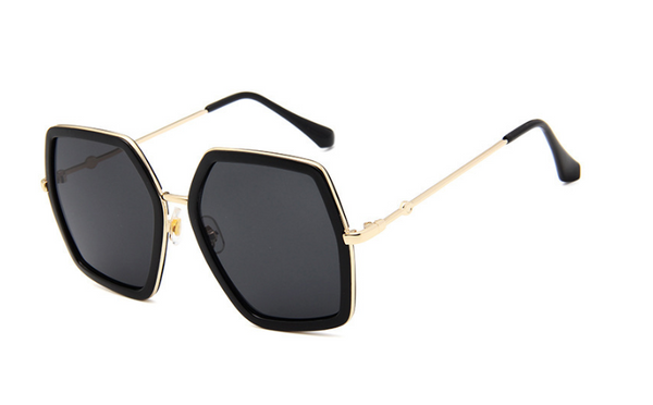 Vintage hexagonal sunglasses with black frames, silver mirrored lenses, and gold-colored metal arms. - Image 4