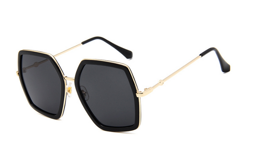 Vintage hexagonal sunglasses with black frames, silver mirrored lenses, and gold-colored metal arms. - Image 4