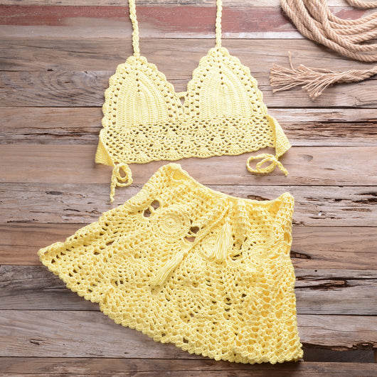 Light beige crochet bikini set with a halter crop top and a matching open-knit mini skirt with tassels. - Image 32