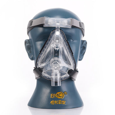 Clear full face oral and nasal mask with gray headgear displayed on a mannequin head for sleep therapy.