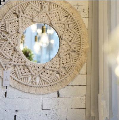 Circular mirror with a beige macrame fringe border, featuring intricate knotwork around the reflective surface. - Image 5