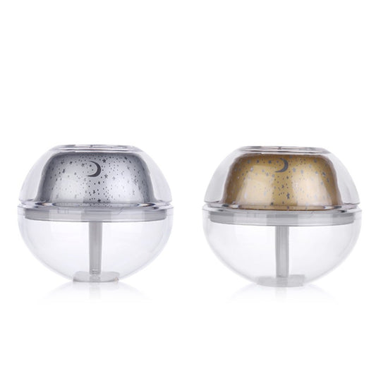 Silver and clear spherical essential oil diffuser with a starry night LED projector, featuring moon and star patterns. - Image 2