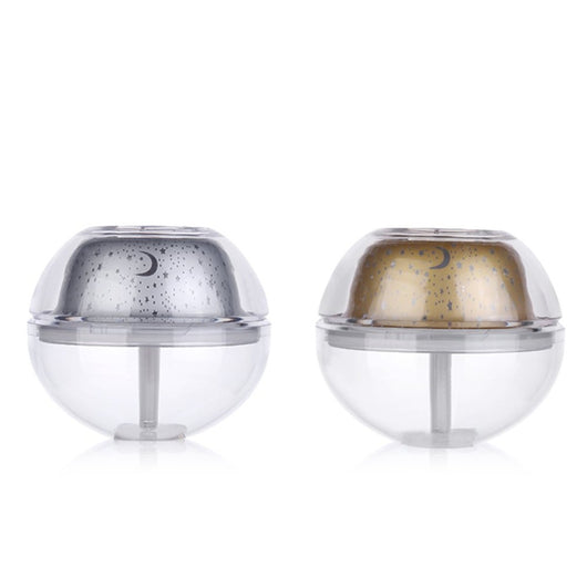 Silver and clear spherical essential oil diffuser with a starry night LED projector, featuring moon and star patterns. - Image 2