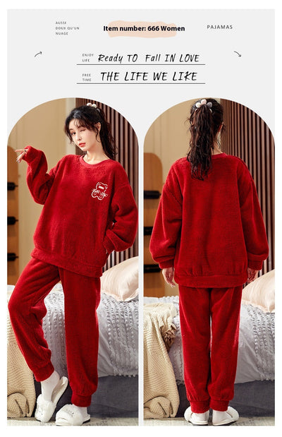 Couple wearing matching cream coral fleece pajamas with gray pants and bear embroidery, seated on a bed. - Image 19