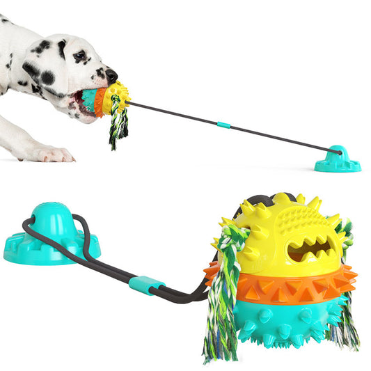Red, white, and blue textured dog chew toy with rope tassels and a blue suction cup base, shown with a Dalmatian puppy playing. - Image 2