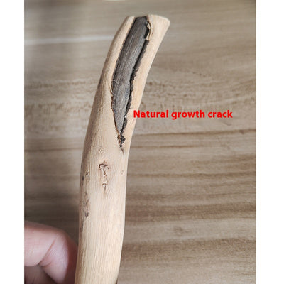 Natural wooden bird perch with an irregular branch-like shape and metal screw attachment, held by a hand. - Image 9