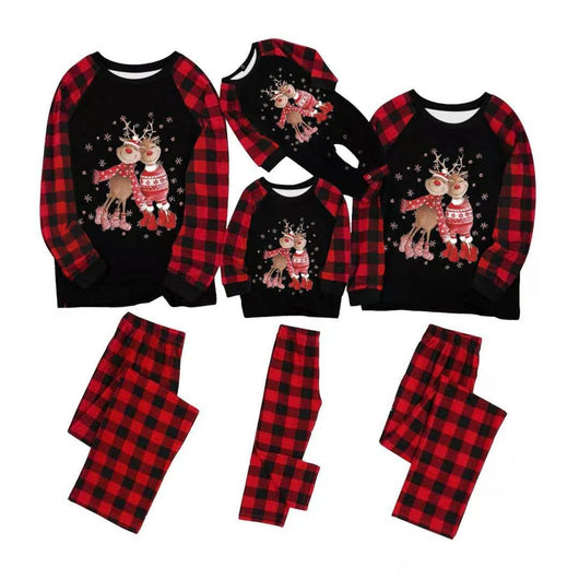 Black long-sleeve Christmas pajama top with reindeer graphic and red buffalo plaid sleeves, matching pants.