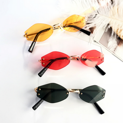 Retro oval vintage sunglasses with orange hexagonal lenses and gold-tone metal temples, held by a hand. - Image 2