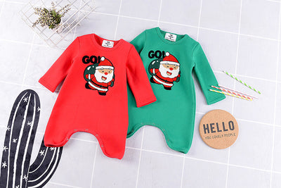 Red parent-child Christmas sweaters with a cartoon Santa Claus graphic, displayed on adult and child mannequins. - Image 13