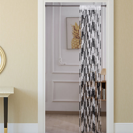 Brown and beige striped string curtain with twisted tassel texture, held by a hand, for living room partition.