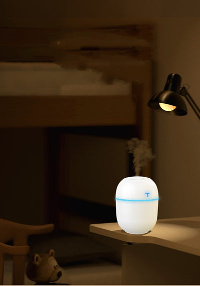 Teal egg-shaped USB humidifier with a glowing blue light band and a 'T' shaped indicator on top. - Image 8