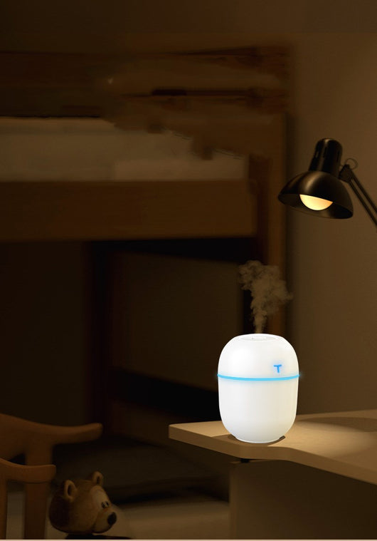 Teal egg-shaped USB humidifier with a glowing blue light band and a 'T' shaped indicator on top. - Image 8