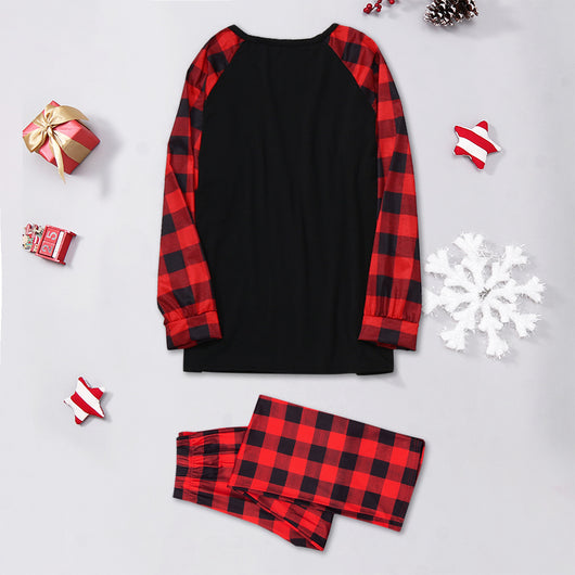Family matching Christmas pajamas with black tops, red plaid sleeves, and Santa wearing a mask, paired with red plaid pants. - Image 3