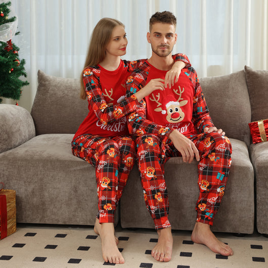 Family matching red Christmas pajamas with a cartoon reindeer and "Merry Christmas" text on a plaid background. - Image 4