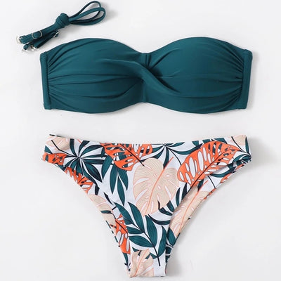 Blue bandeau bikini top with tropical leaf print high-cut bottom, styled with sandals, sunglasses, and a straw hat. - Image 6