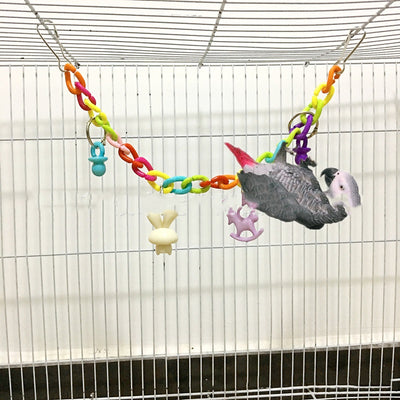 Colorful acrylic chain suspension bridge swing toy with hanging charms for parrots, installed in a white bird cage. - Image 10