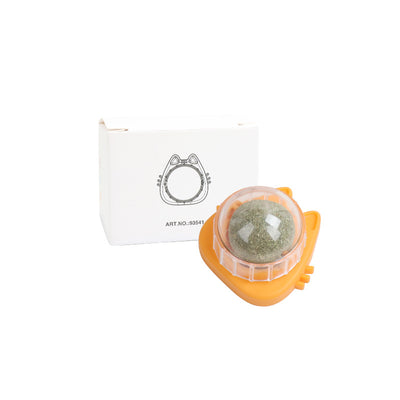 Orange carrot-shaped cat toy with a clear dome holding a rotating catnip ball, next to its white packaging box. - Image 5