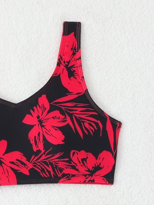 Women's two-piece swimsuit with black and purple floral print. Features a V-neck sports bra top and mid-rise bottom. - Image 13