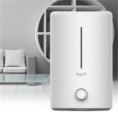 White cylindrical air aroma diffuser with a vertical water level indicator and a control knob on the front. - Image 3