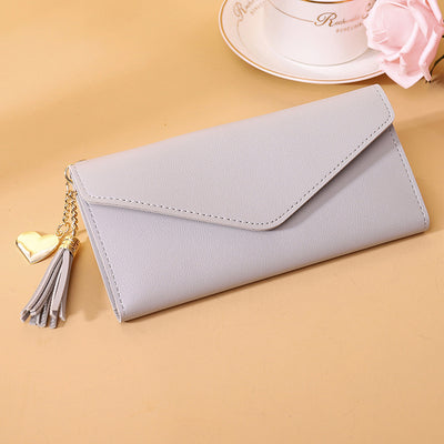 Bolso de mano con borlas decorativas - Image 11
