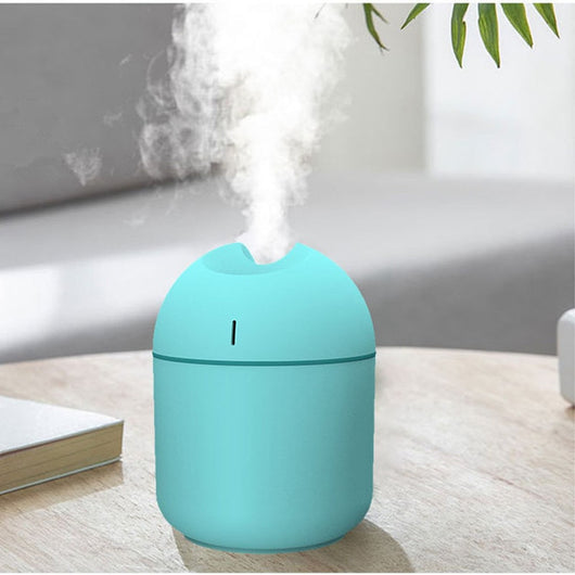 Pink aromatherapy humidifier with a minimalist design and a single mist outlet. - Image 2
