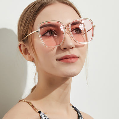 Big square sunglasses for women with transparent pink frames and pink gradient lenses, featuring gold-tone metal temples. - Image 3