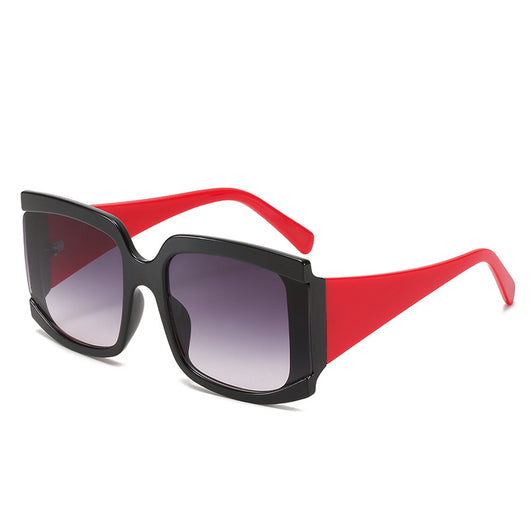 Oversized square-frame sunglasses with a light pink frame and gradient lenses transitioning from purple to orange to yellow. - Image 4