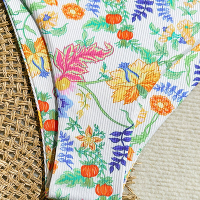White ribbed two-piece bikini with colorful floral print, featuring a bandeau top and high-cut bottom. - Image 4