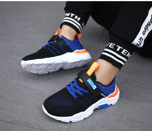 Boy's black and blue sports shoes with orange accents, mesh upper, white sole, blue laces, and a Velcro strap. - Image 37