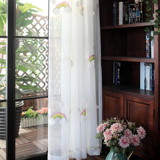 White sheer gauze curtain with colorful embroidered rainbows and grey clouds, suitable for a child's room. - Image 9