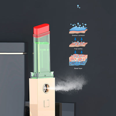 Two sleek black and gold nano spray water replenishing instruments on a dark, reflective surface. - Image 3