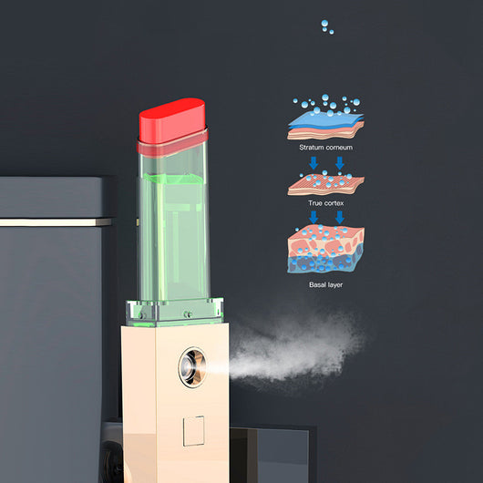 Two sleek black and gold nano spray water replenishing instruments on a dark, reflective surface. - Image 3