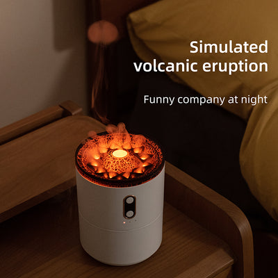 White volcanic flame aroma essential oil diffuser emitting orange light and mist on a wooden desk next to a laptop. - Image 5