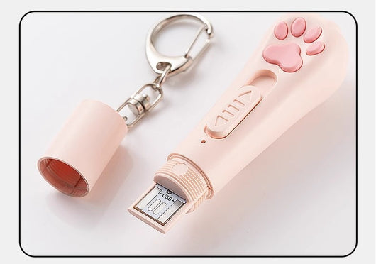 Pink cat paw pen light toy with red laser, UV light for urine detection, and white LED illumination, featuring a keychain. - Image 13
